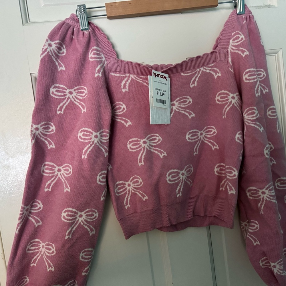 Pink Sweater with White Bow Pattern